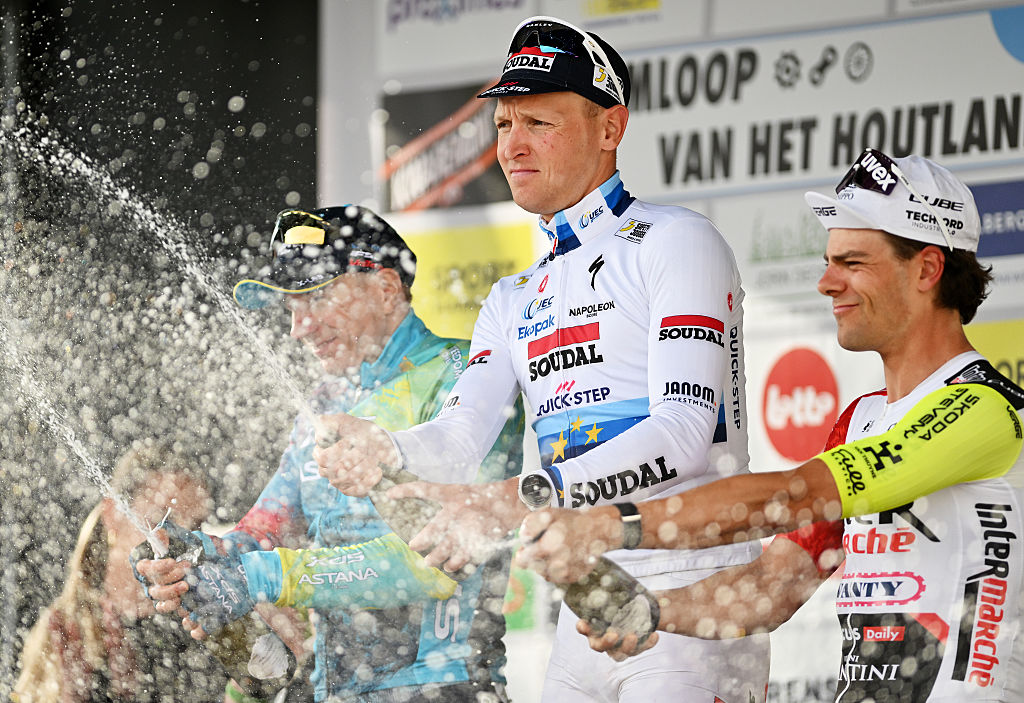 LICHTERVELDE, BELGIUM - SEPTEMBER 24: (L-R) Max Kanter of Germany and XDS Astana Team on second place, race winner Tim Merlier of Belgium and Soudal Quick-Step and Arne Marit of Belgium and Intermarche - Wanty on third place pose and celebrate on the podium ceremony after the 78th Omloop van het Houtland 2025 a 198.7km one day race from Eernegem to Lichtervelde on September 24, 2025 in Lichtervelde, Belgium. (Photo by Luc Claessen/Getty Images)
