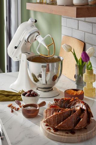 kitchenaid and cake on countertop