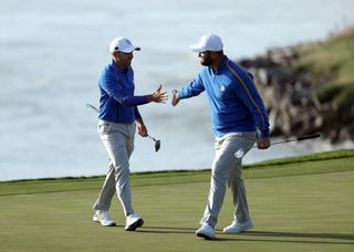 Jon Rahm and Sergio Garcia embrace at the 2021 Ryder Cup
