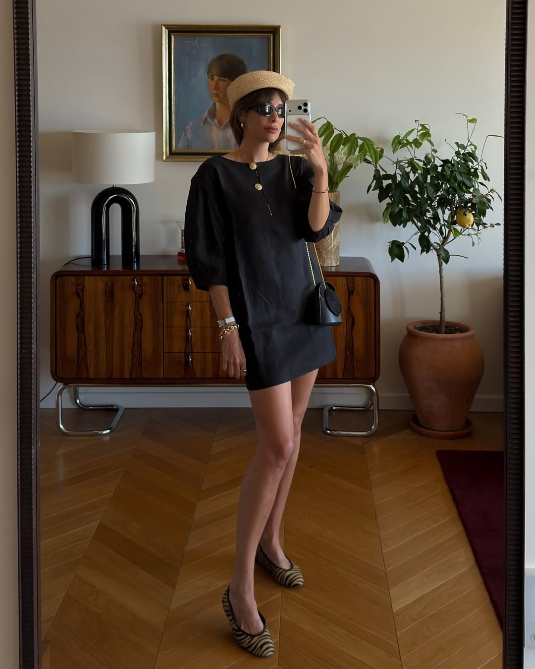 Impressive Julie Sergeant Ferreri wears a black mini dress, ballet flats and a pillbox hat.