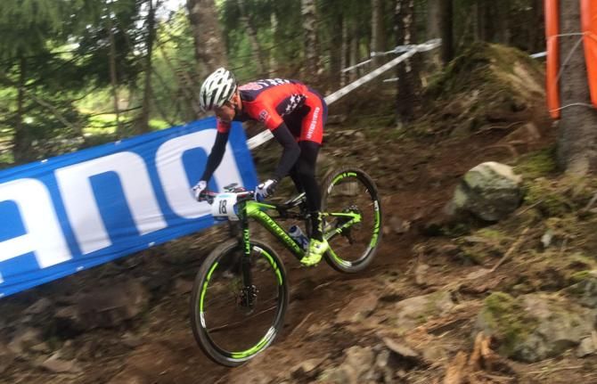 Keegan Swenson flies down a rocky trail