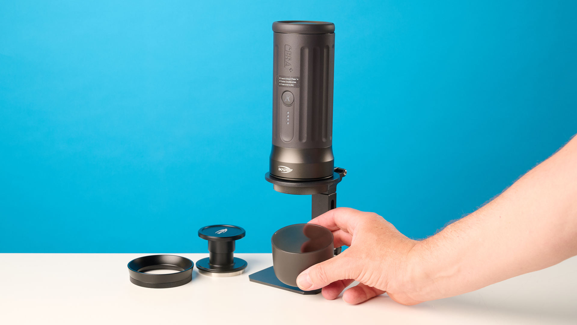 the ikape kapo k2 pro portable coffee maker against a blue background
