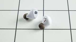 A pair of SteelSeries Arctis GameBuds wireless earbuds