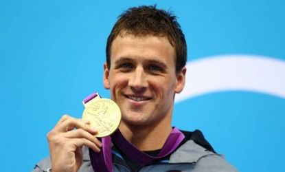 Ryan Lochte celebrates with his gold medal for winning the Men's 400m Individual Medley on Day 1 of the London 2012 Olympic Games.