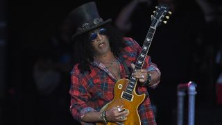 Slash performing on-stage with Guns N Roses