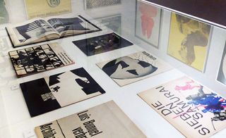 A table with posters on display.