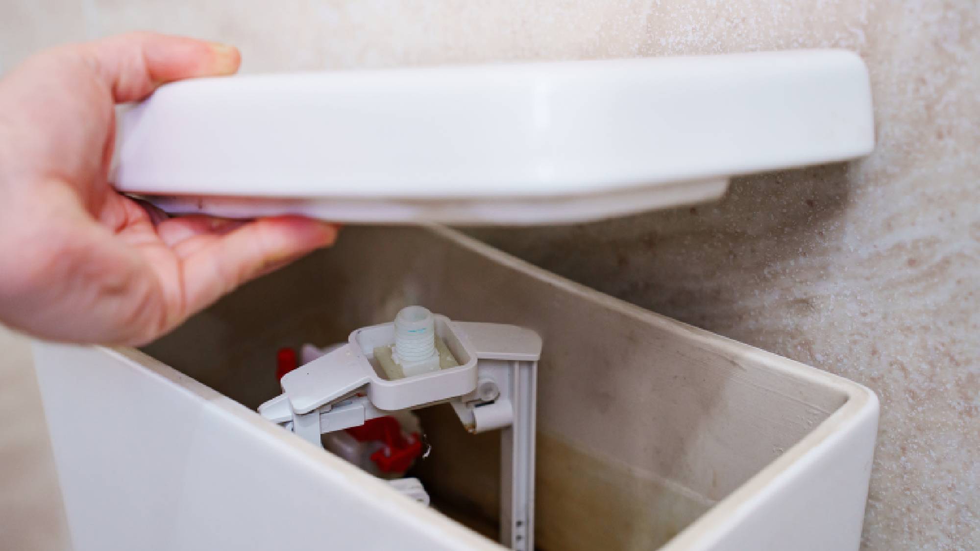 Hand lifting toilet tank
