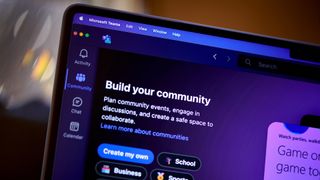 Microsoft Teams app with logo and community section displayed on a laptop screen.