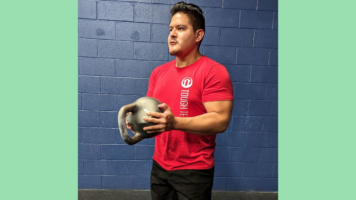 Gio Amatore performing the crush grip kettlebell curl