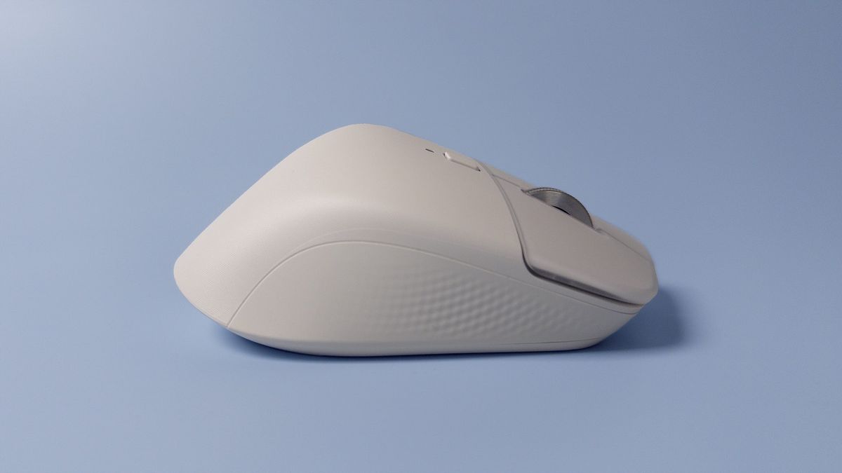 The Logitech MX Master 4 mouse against a blue background.