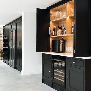 black units in kitchen with wine cooler and drinks cabinet