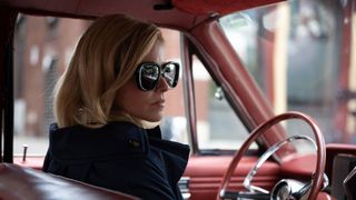 Elizabeth Banks as Joy driving a car in Call Jane
