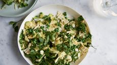 Overhead of a raw cauliflower, pea and herb salad