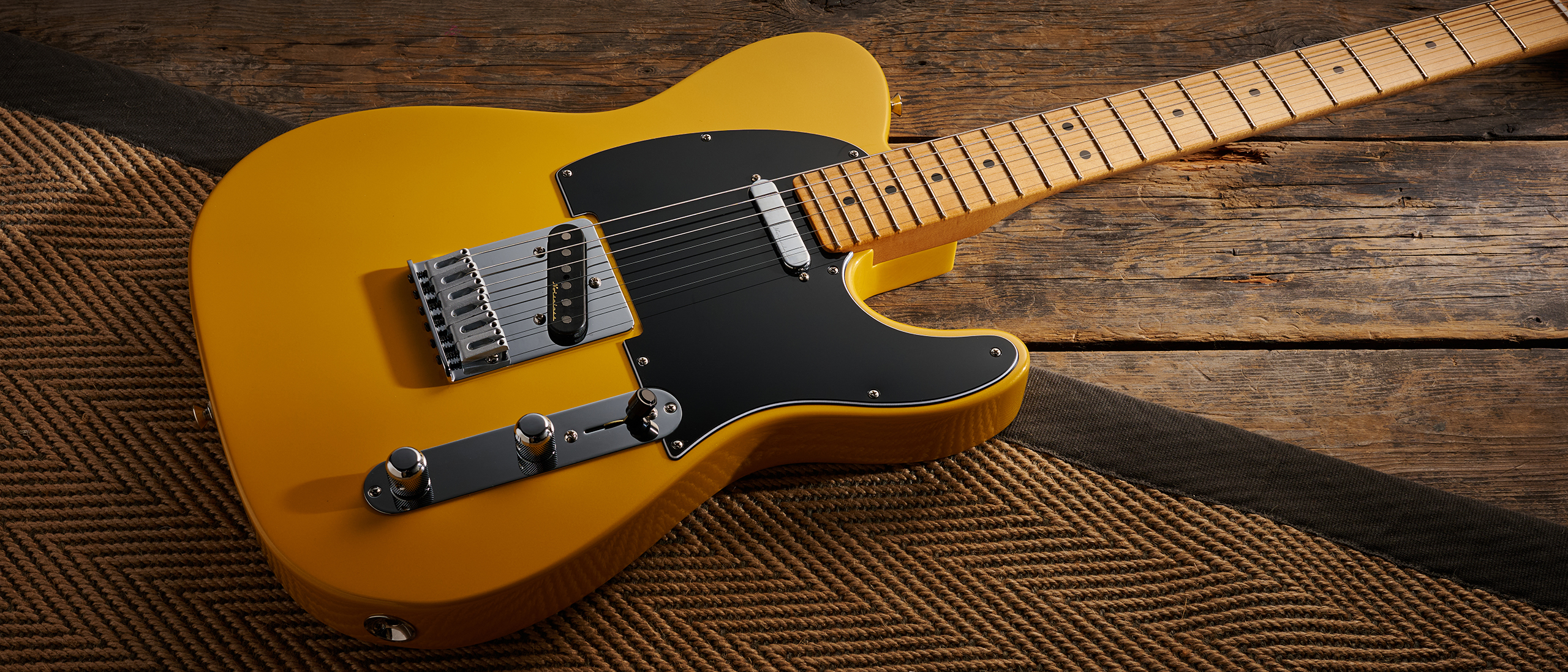 A Fender Player II Modified Telecaster lying on a rug