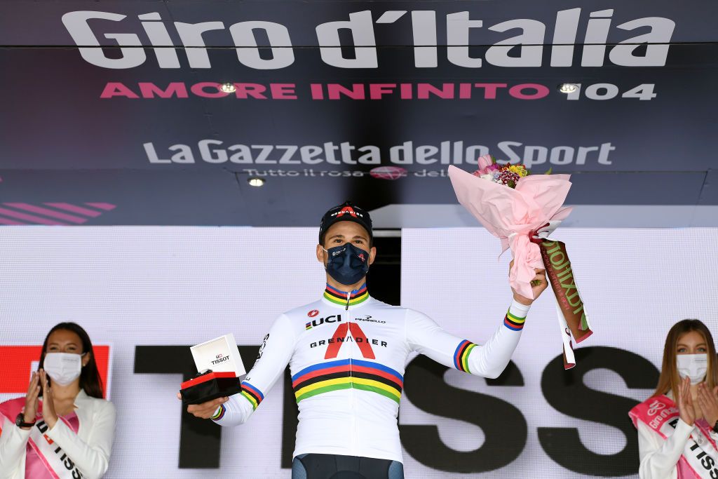 TURIN ITALY MAY 08 Filippo Ganna of Italy and Team INEOS Grenadiers stage winner celebrates at podium during the 104th Giro dItalia 2021 Stage 1 a 86km Individual Time Trial stage from Torino to Torino Mask Covid safety measures Trophy Kask Helmet special edition ITT girodiitalia Giro on May 08 2021 in Turin Italy Photo by Tim de WaeleGetty Images