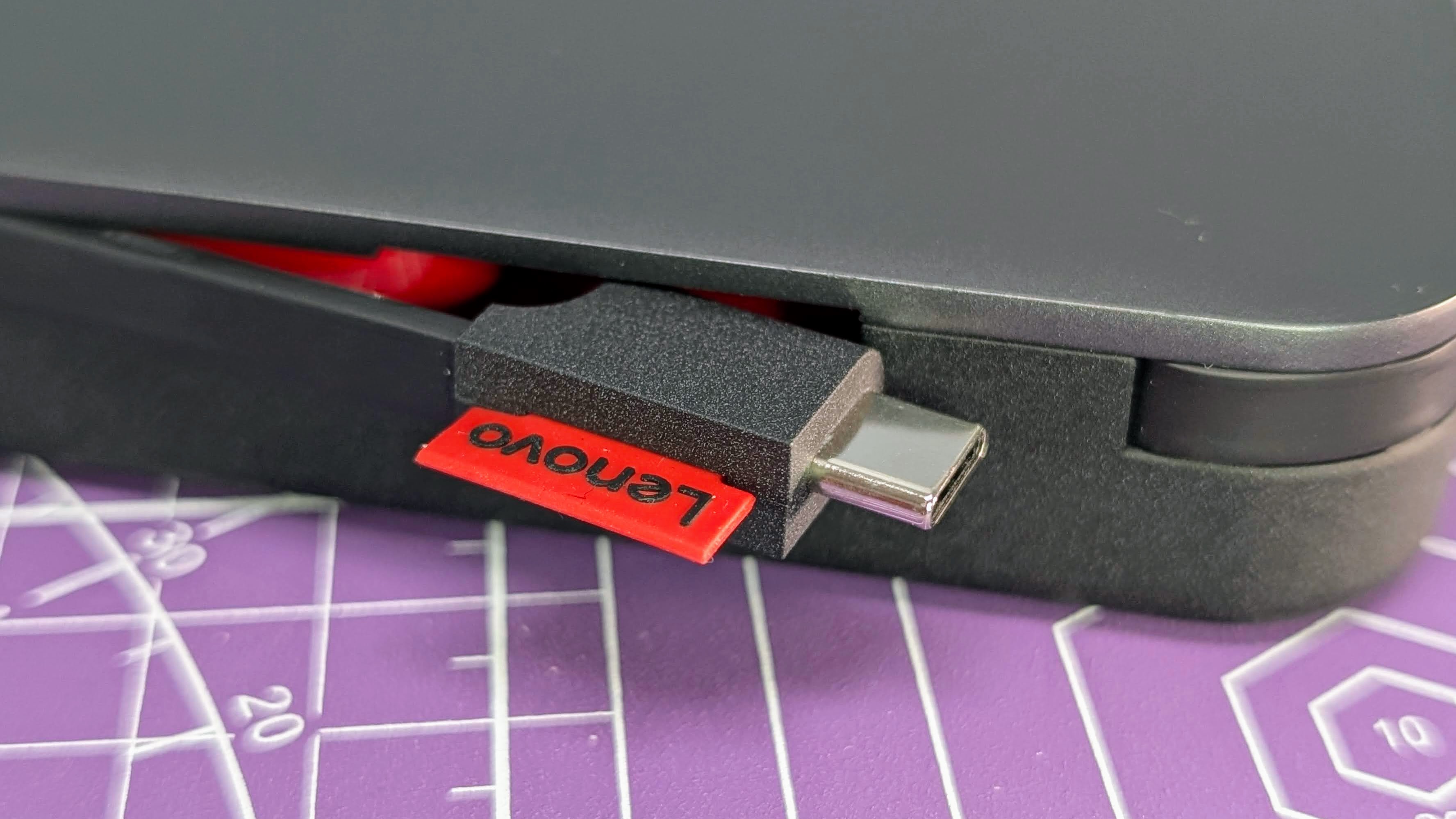 Lenovo Go USB-C laptop power bank close up of USB-C cable end just starting to be deployed