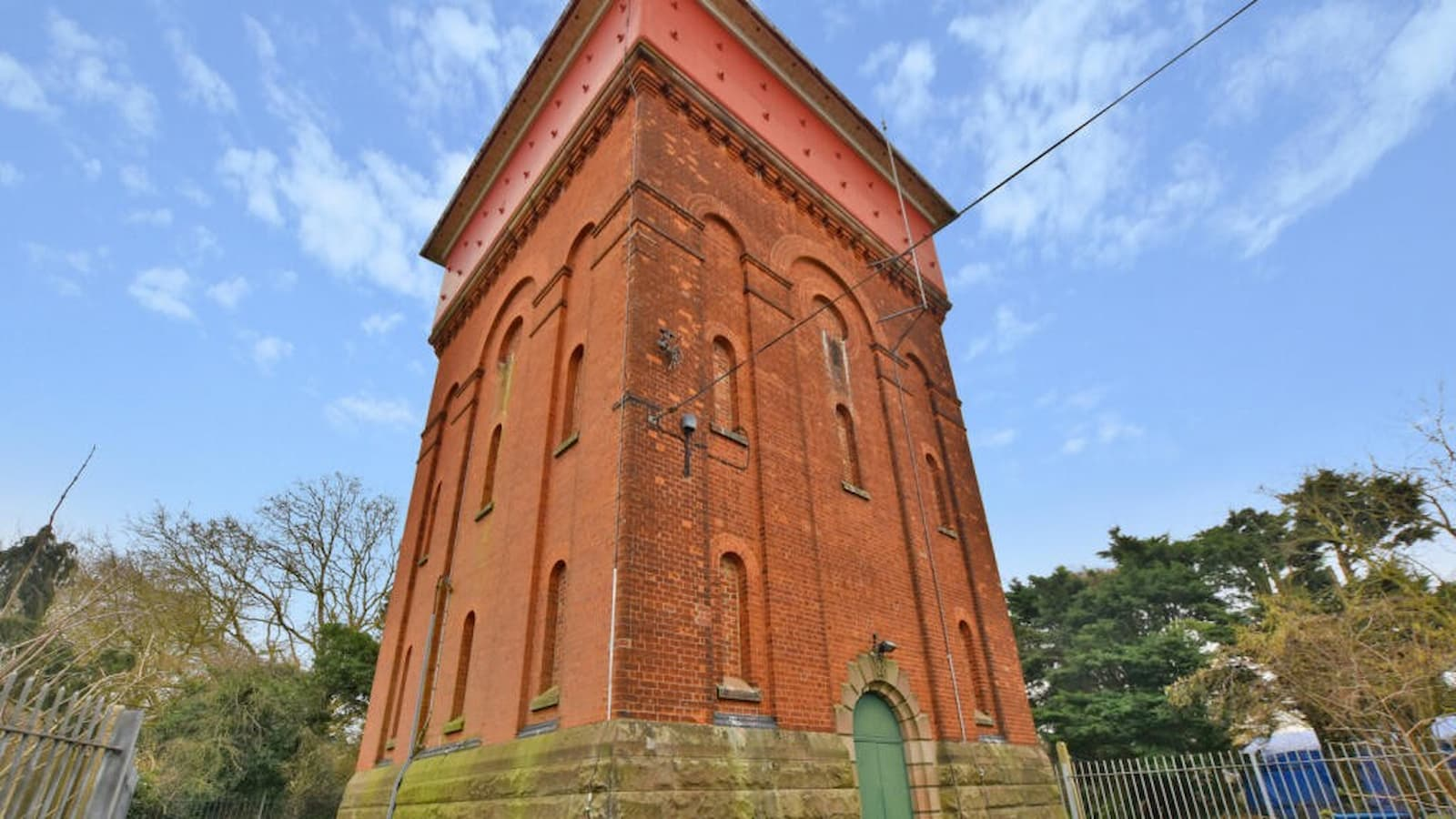 A red brick, three storey water tower 