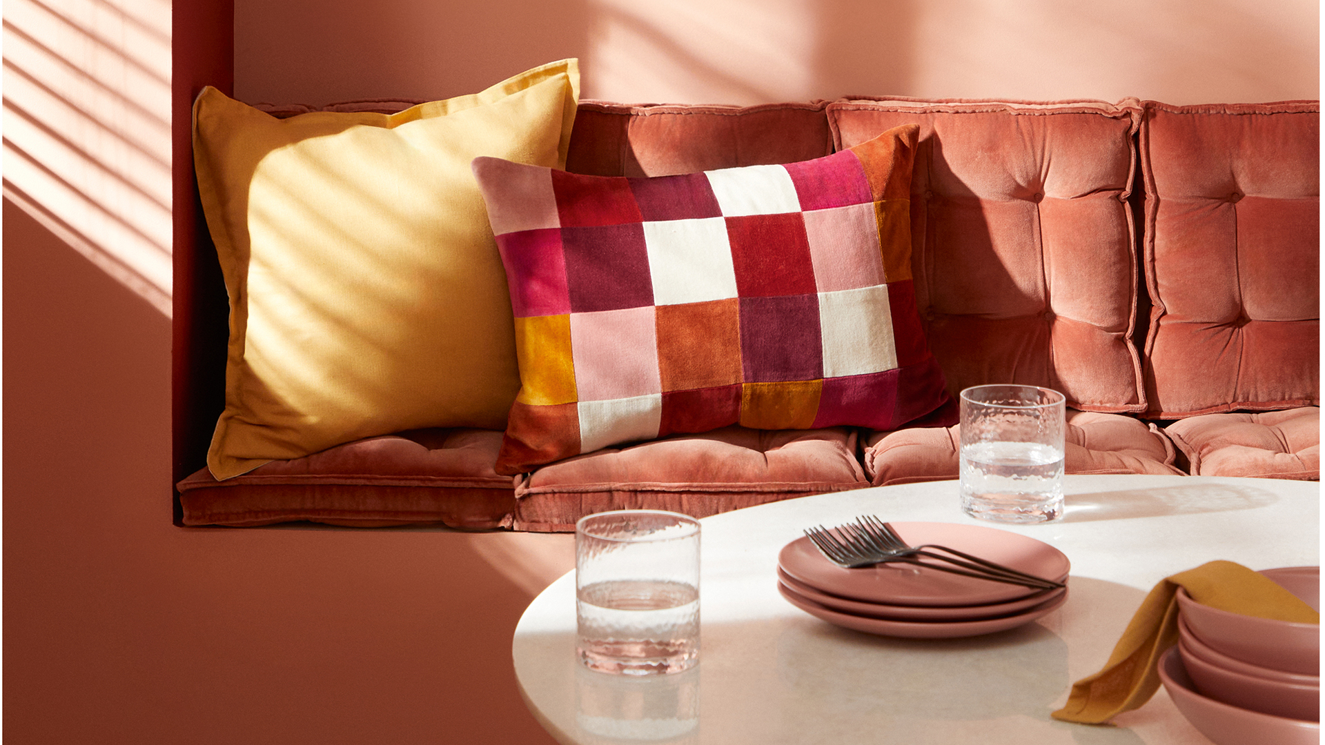 Close p of a sofa with cushions