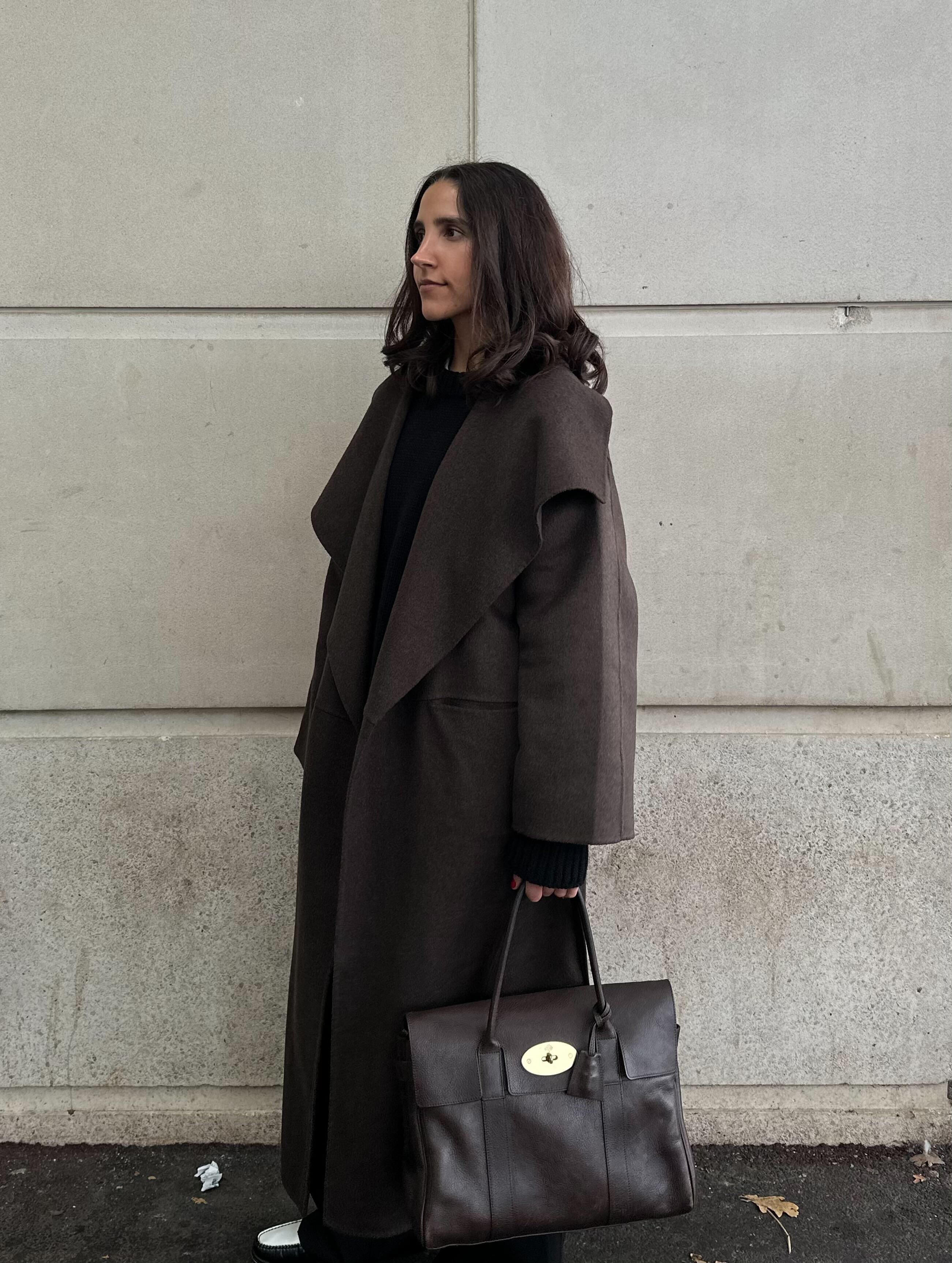 An image of Huuma Hussain trying the Mulberry Bayswater, one of the best work bags.