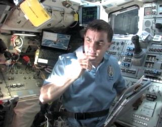 Atlantis astronaut Rex Walheim speaks