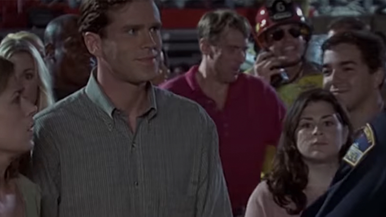 Jim Carrey as Fire Marshall Bill in the background in Liar, Liar