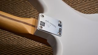 The neck plate of the Fender Player II Jaguar