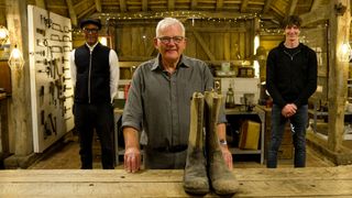 Jay Blades, Dean Westmoreland and Malcom Britton with some war boots in The Repair Shop