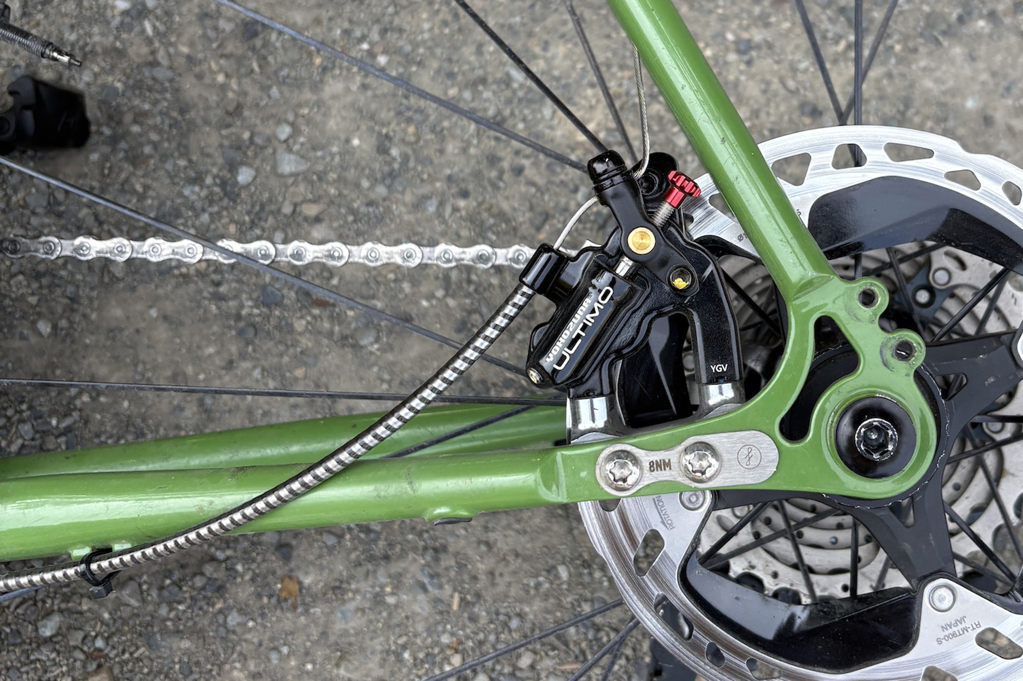 Yokozuna Ultimo mounted to a green bike with a shimano rotor