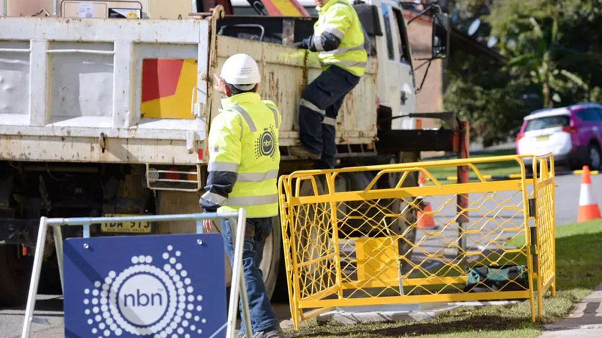 Two NBN technicians installing fibre infrastructure