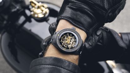 Rado Captain Cook High-Tech Limited Edition on a black motorbike