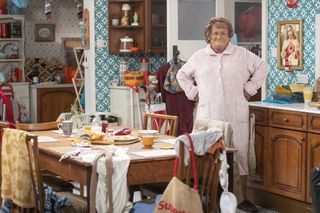 Mammy looks at the mess of her house.