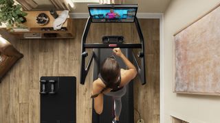 Woman running on Peloton Tread