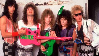 Racer X posing for a photograph with their guitars in 1987