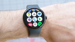 A close-up of the Google Pixel 9 showing the process for enabling Loss of Pulse Detection on the Pixel Watch 3