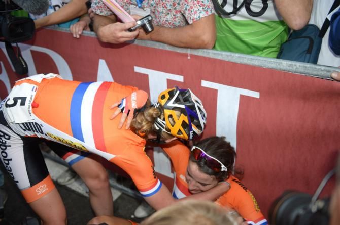Newly crowned road race world champion Marianne Vos is congratulated by teammate Anna van der Breggen