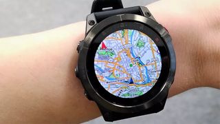 Map on a Garmin Epix watch on woman's wrist