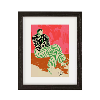 colorful wall art of a woman lounging on a chair