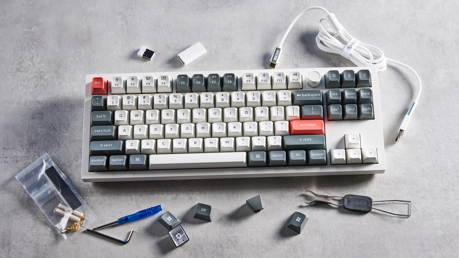 Keychron Q3 Ultra 8K photographed on a grey table in front of a blue background