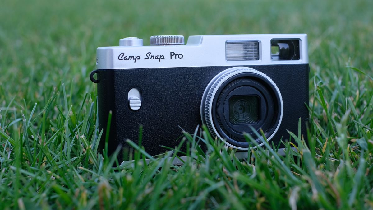 Photograph of Camp Snap CS-Pro digital compact camera standing upright in grass