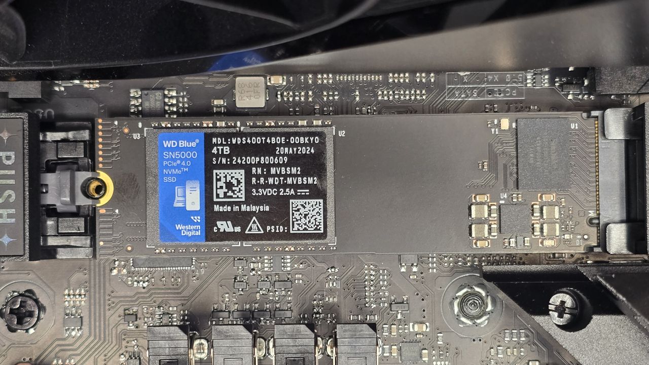 A WD SN5000 SSD out of its box and installed in a PC's NVMe slot.