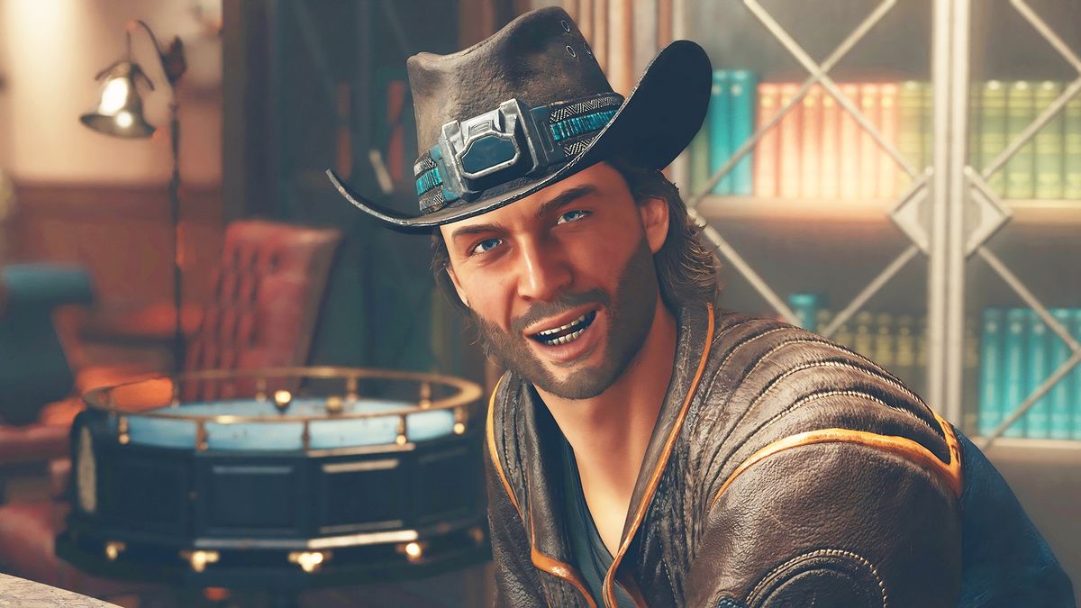 Close-up of man grinning with a cowboy hat