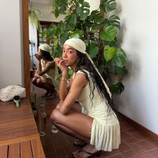 Amaka Hamelijnck with knotless braids and glowing skin