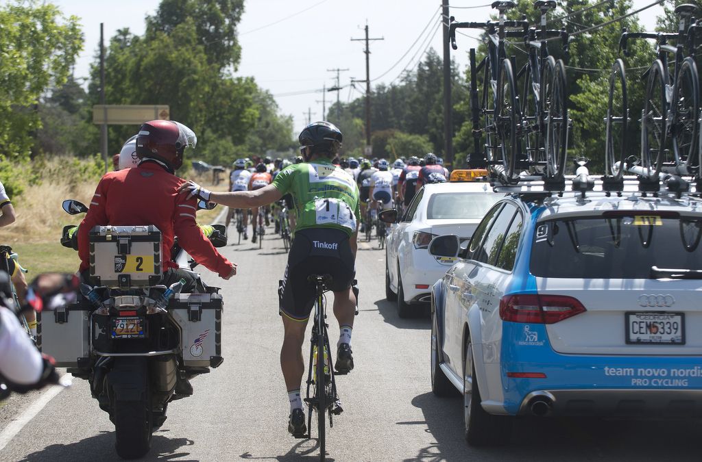 Peter Sagan at the back of the convoy with a moto rider