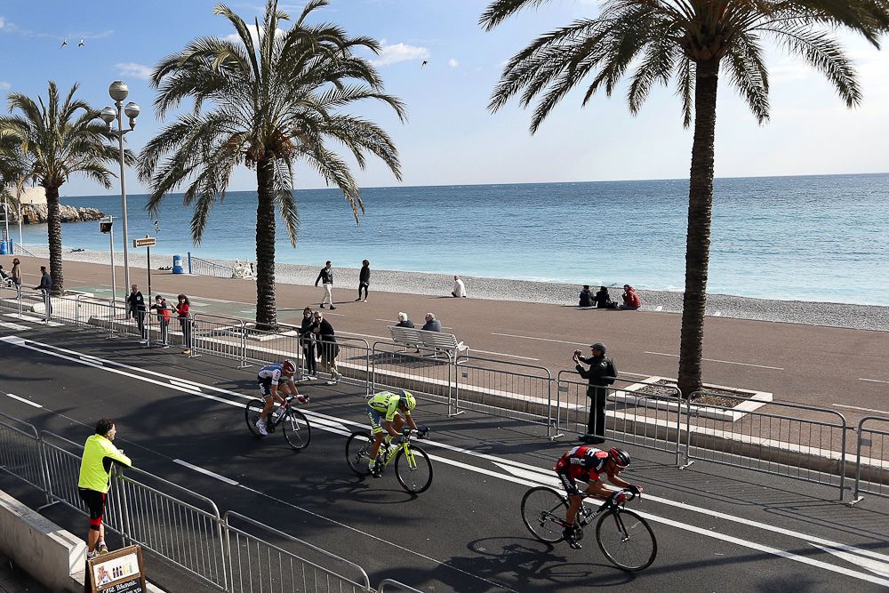 Richie Porte (R), Spain's Alberto Contador (C) and Belgium's Tim Wellens (L) ride on the 'Promenade des Anglais' during the finish of the seventh stage