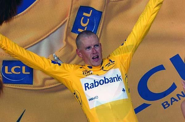 Rasmussen celebrates his yellow jersey.