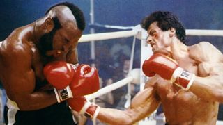 Rocky punches Clubber Lang in the side in Rocky III