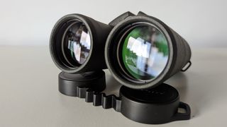 A close up of the objective lenses on the binoculars