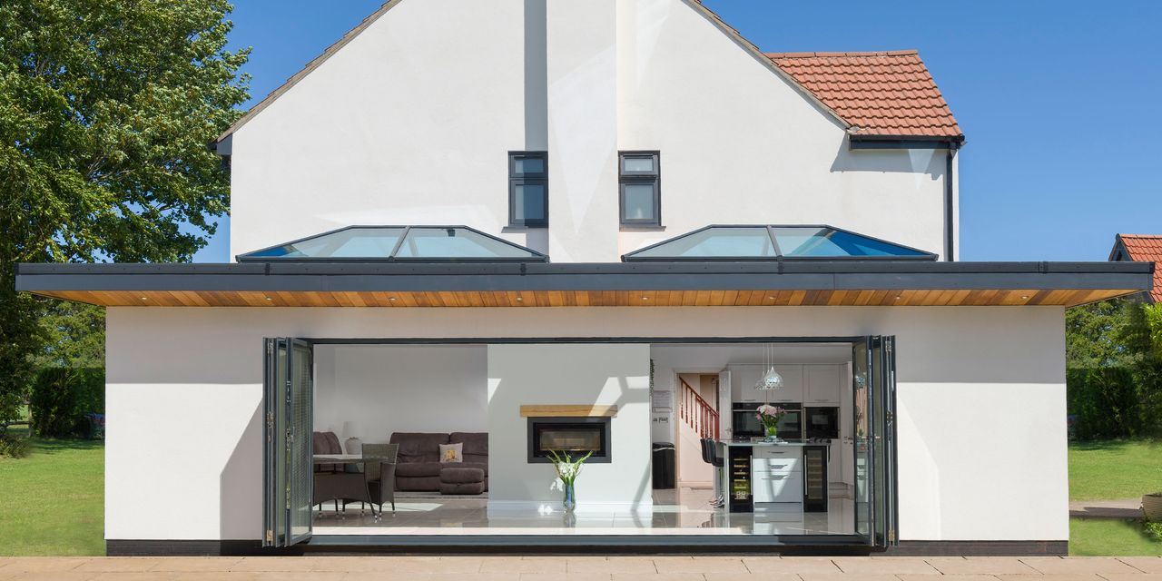 Bi-folding doors and roof lanterns bring in the light and create a garden link