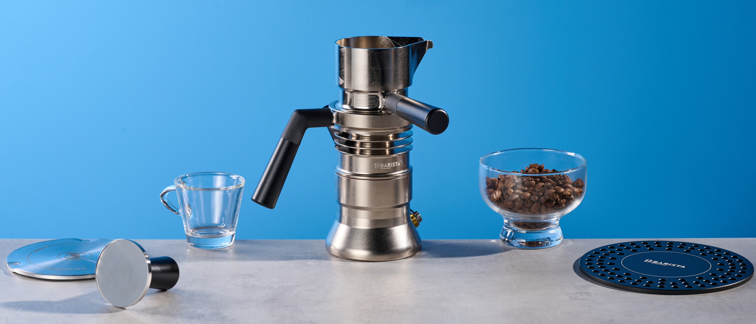 The 9Barista Espresso Machine Mk.2 with accessories and coffee beans