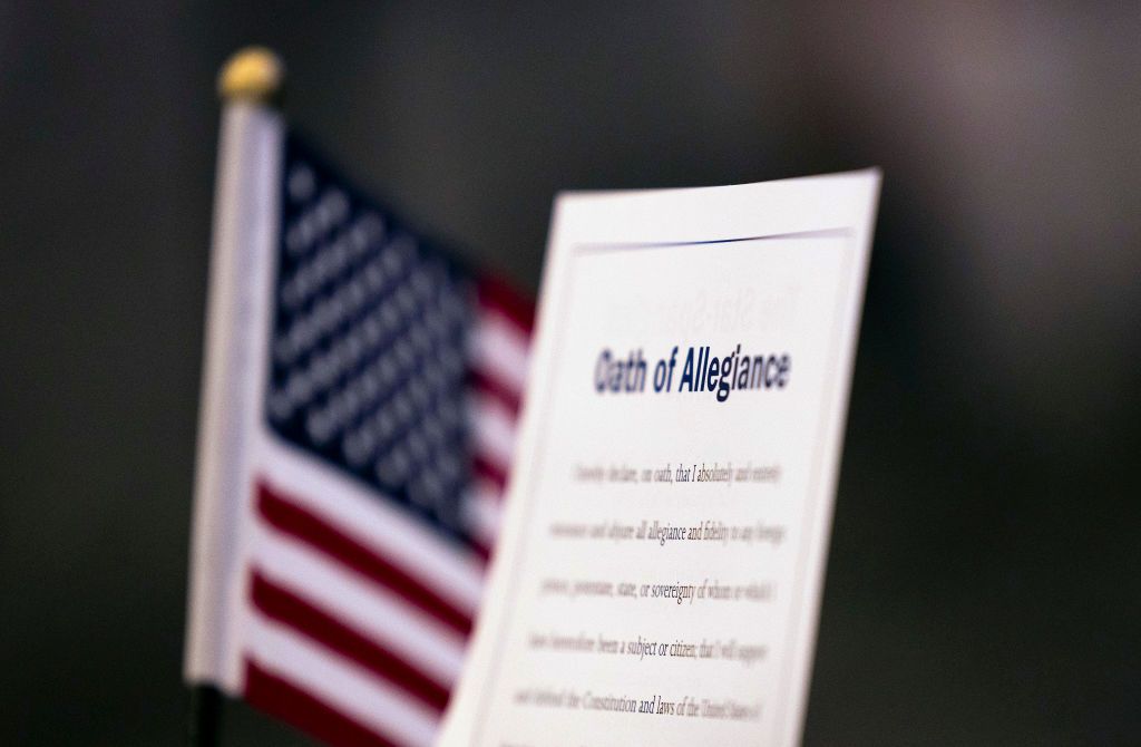 Oath of allegiance during citizenship ceremony.